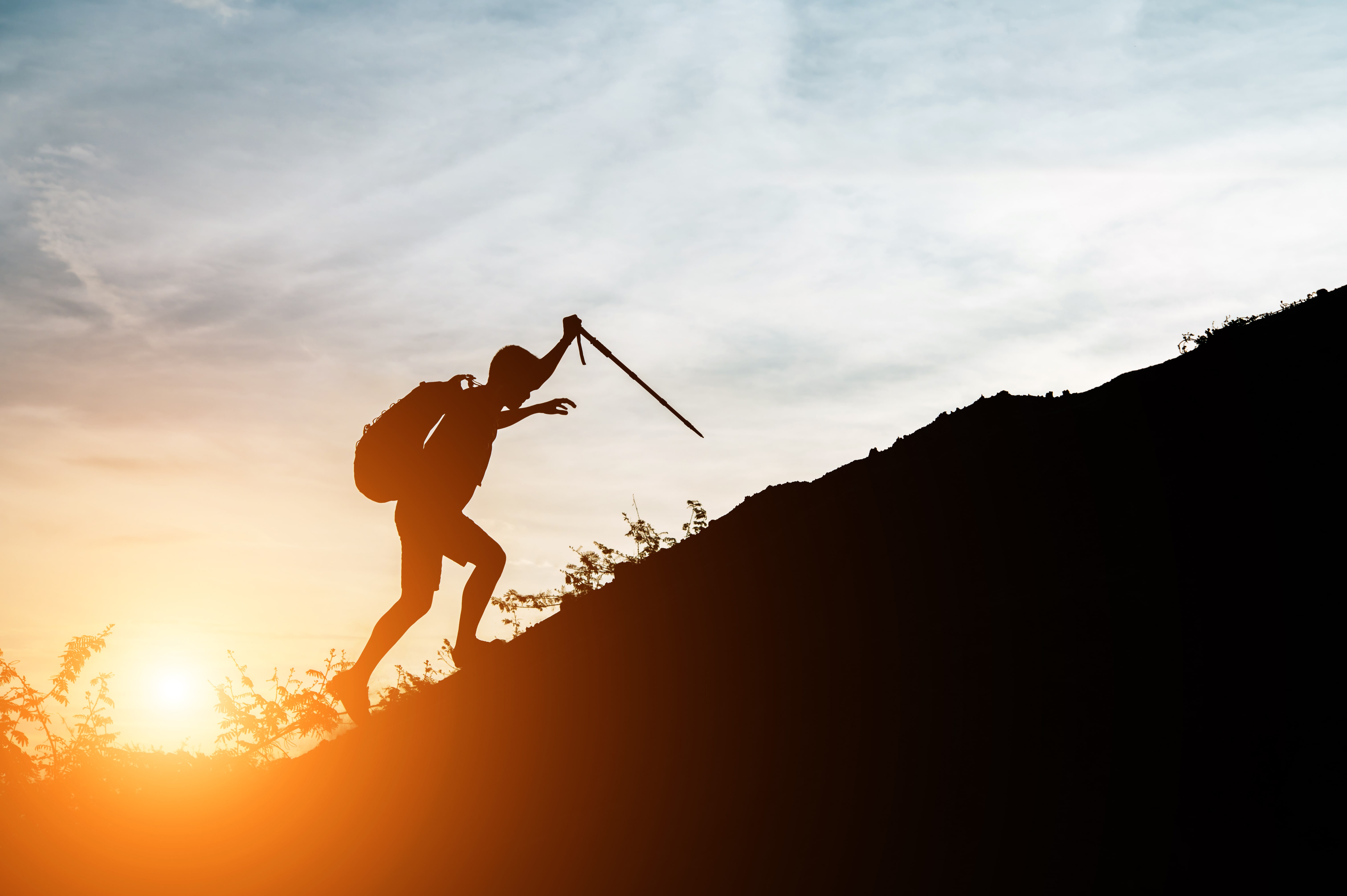 Person climbing a mountain trail